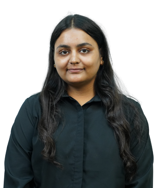 Portrait of a woman with long dark hair wearing a black button-up shirt, looking at the camera with a neutral expression, against a plain background.