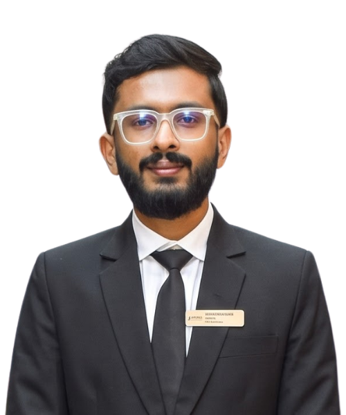 Professional man with a beard and glasses in a black suit and tie, wearing a name badge on a plain background.