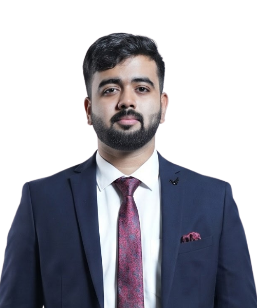 Man in a navy suit and burgundy tie posing for a professional portrait with a pocket square visible on the left side.