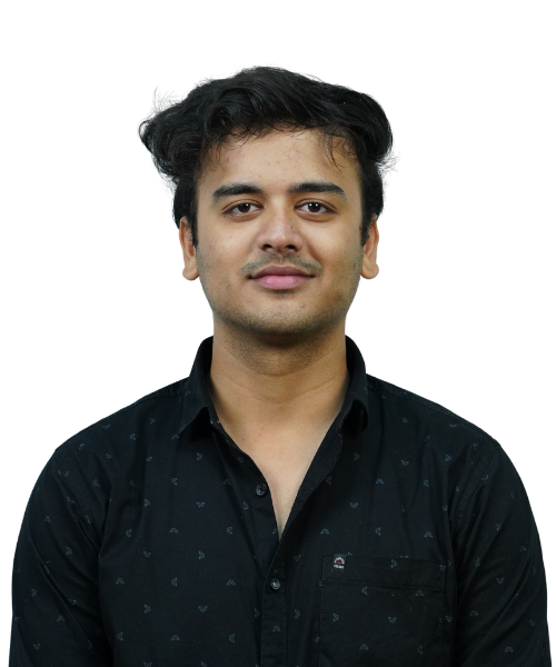Portrait of a young man with short dark hair wearing a black button-down shirt, looking at the camera with a slight smile.