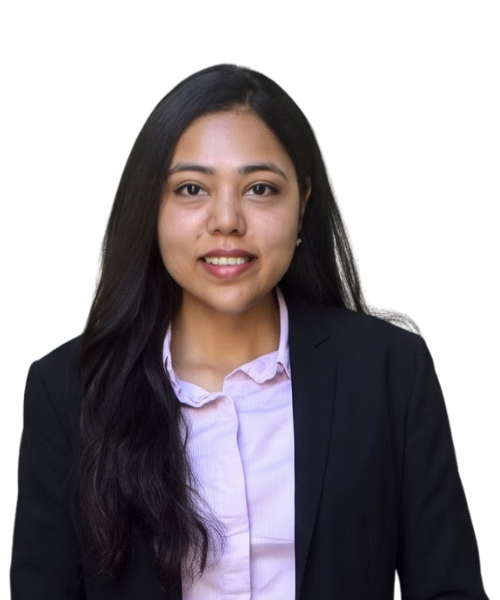 Professional headshot of a smiling woman with long dark hair, wearing a black blazer and light purple blouse against a neutral background.