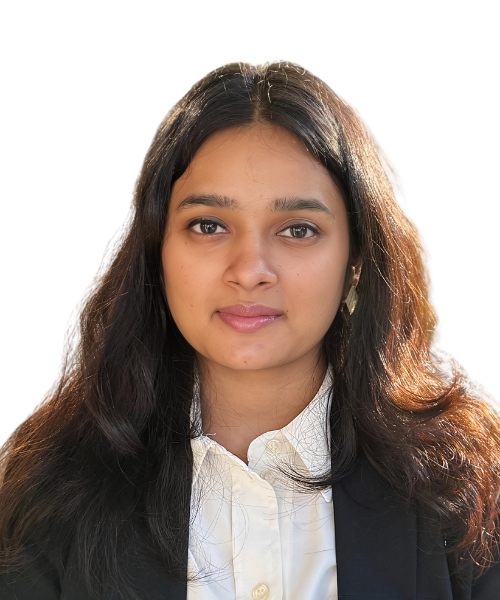 Professional headshot of a woman with long dark hair wearing a white blouse and black blazer, looking at the camera.