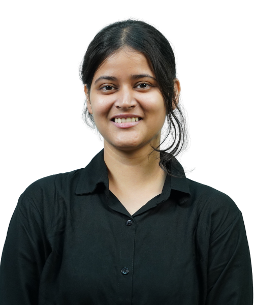 Portrait of a woman with dark hair tied back, wearing a black shirt, smiling at the camera.