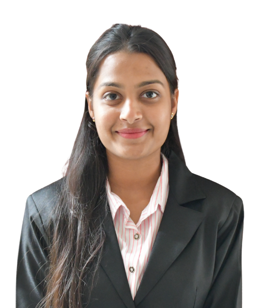 Professional headshot: smiling woman with long dark hair, wearing a black blazer and pink striped shirt, facing the camera.