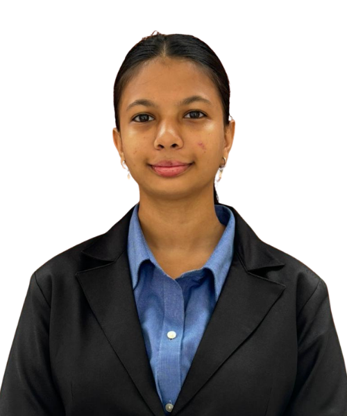 Professional head-and-shoulders portrait of a young woman in a black blazer and blue shirt, looking at the camera.