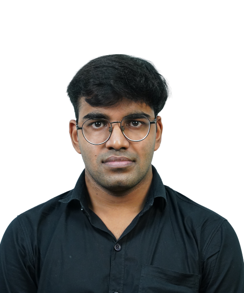 Portrait of a man with short black hair and round glasses wearing a black button-down shirt, looking at the camera with a neutral expression.