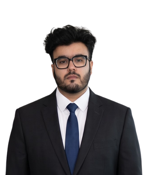 Professional man in a black suit, white shirt, and blue tie, facing the camera with a neutral expression.